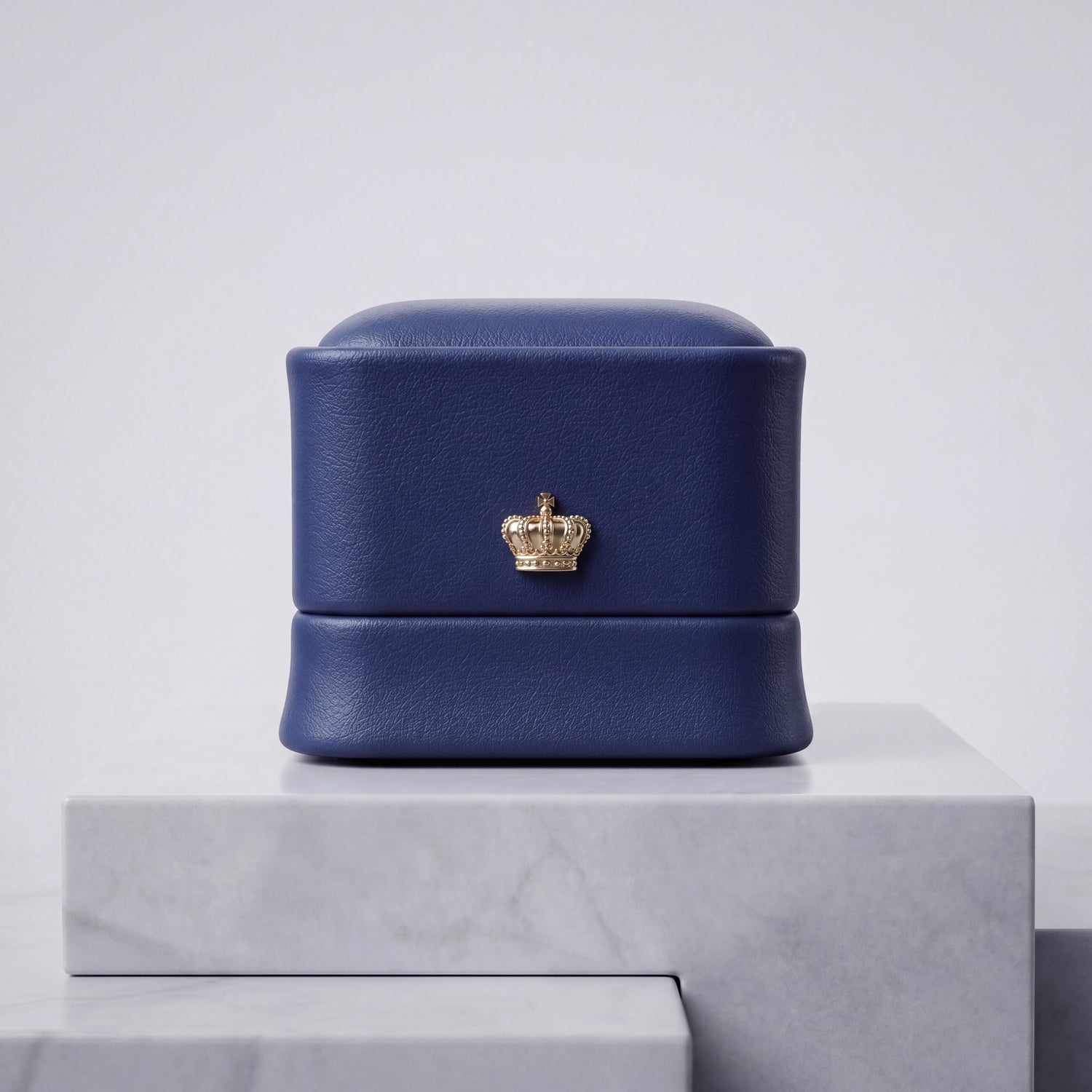 Sapphire Blue leather ring box closed front view with gold crown · Ormelya