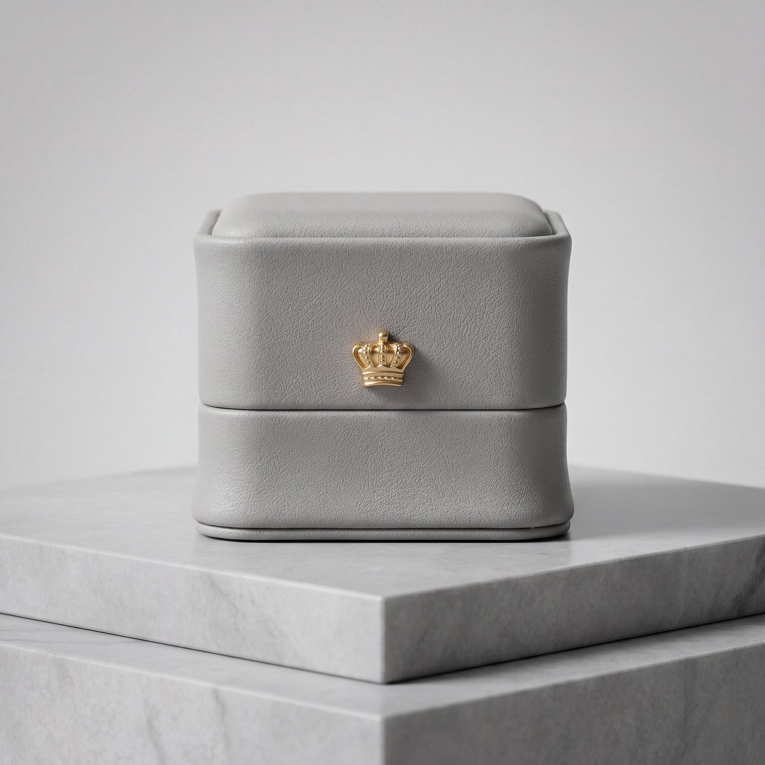 Slate Grey leather ring box closed front view with gold crown · Ormelya