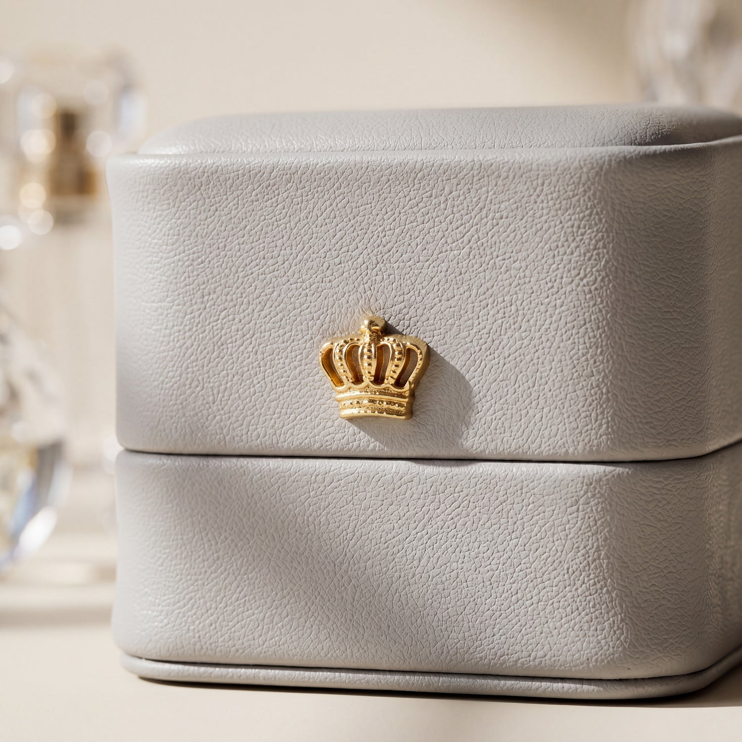 Slate Grey ring box leather texture close-up gold crown detail · Ormelya