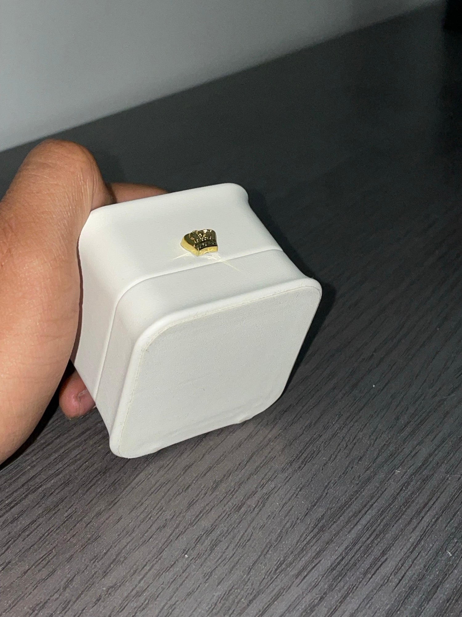 Ormelya Signature vegan leather ring box held in hand in soft window light before the wedding