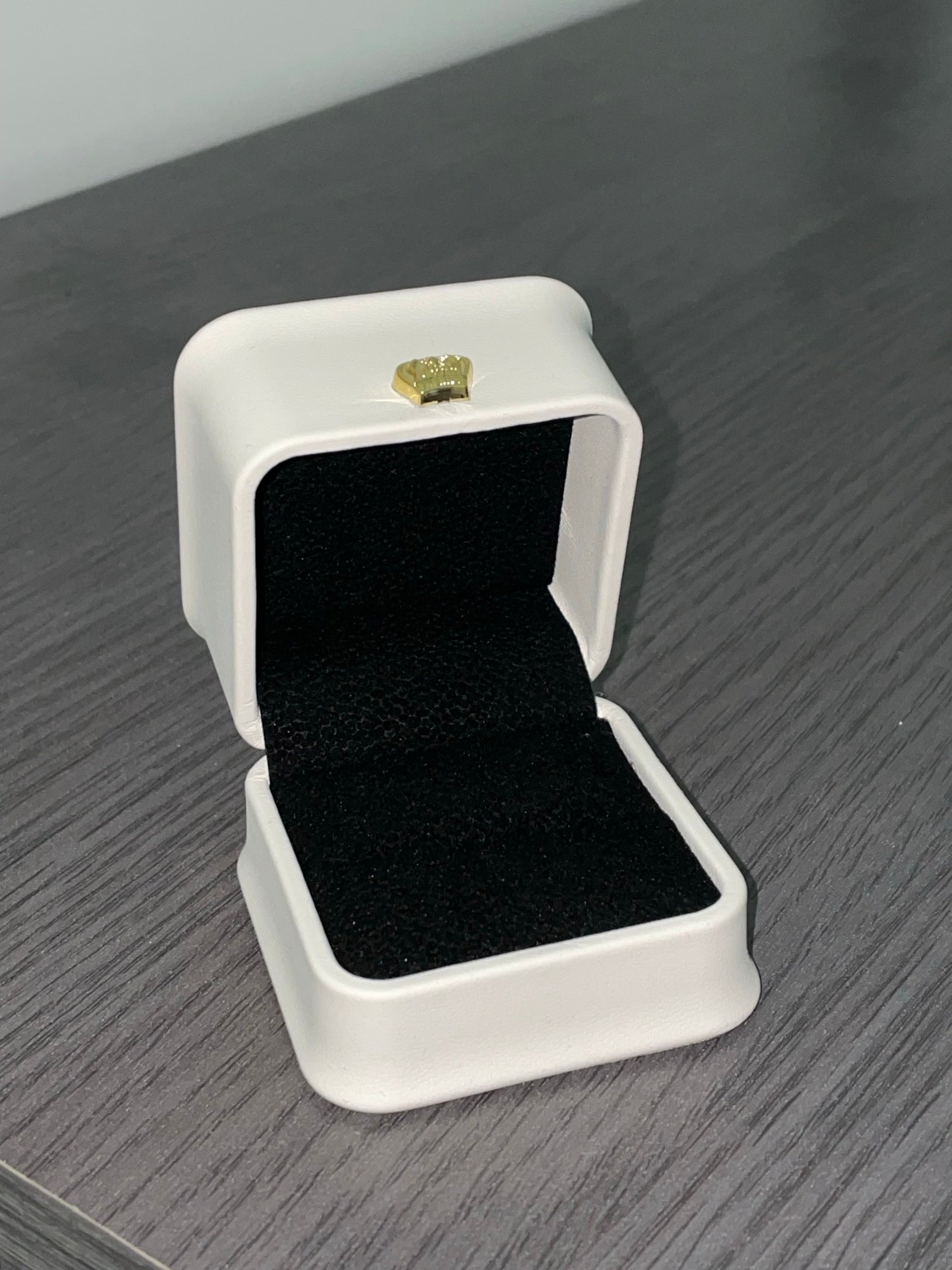 Ormelya Signature ivory ring box open showing black velvet interior for an oval diamond