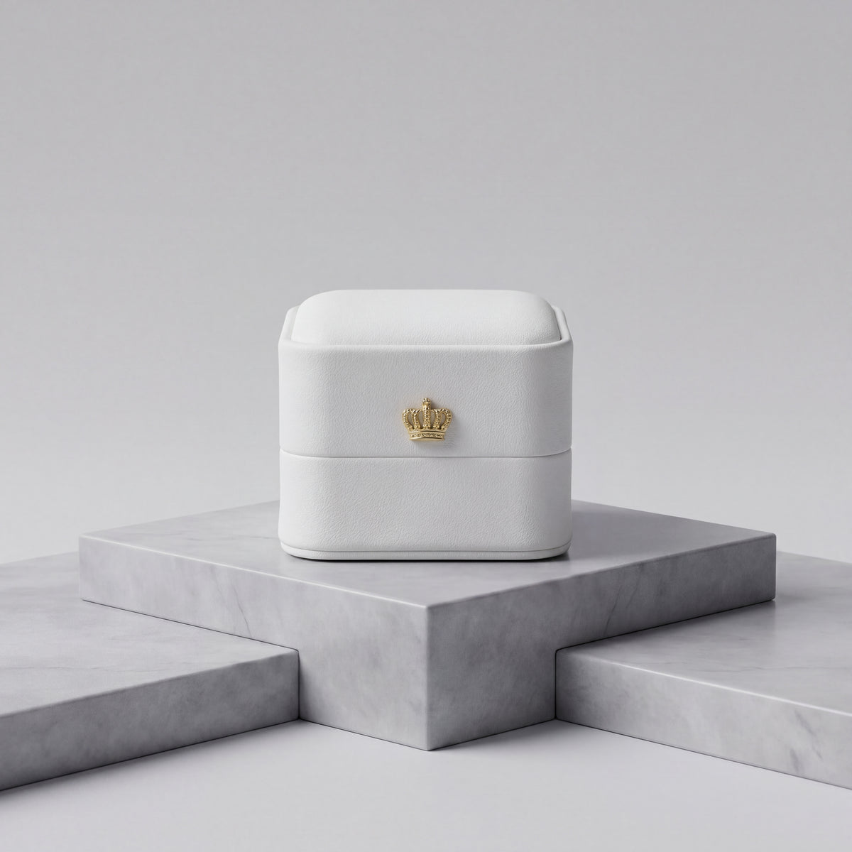 Pearl White leather ring box closed front view with gold crown · Ormelya