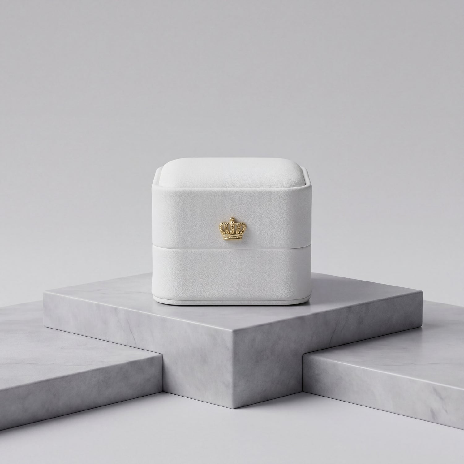 Pearl White leather ring box closed front view with gold crown · Ormelya