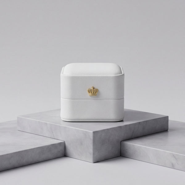 Pearl White leather ring box closed front view with gold crown · Ormelya