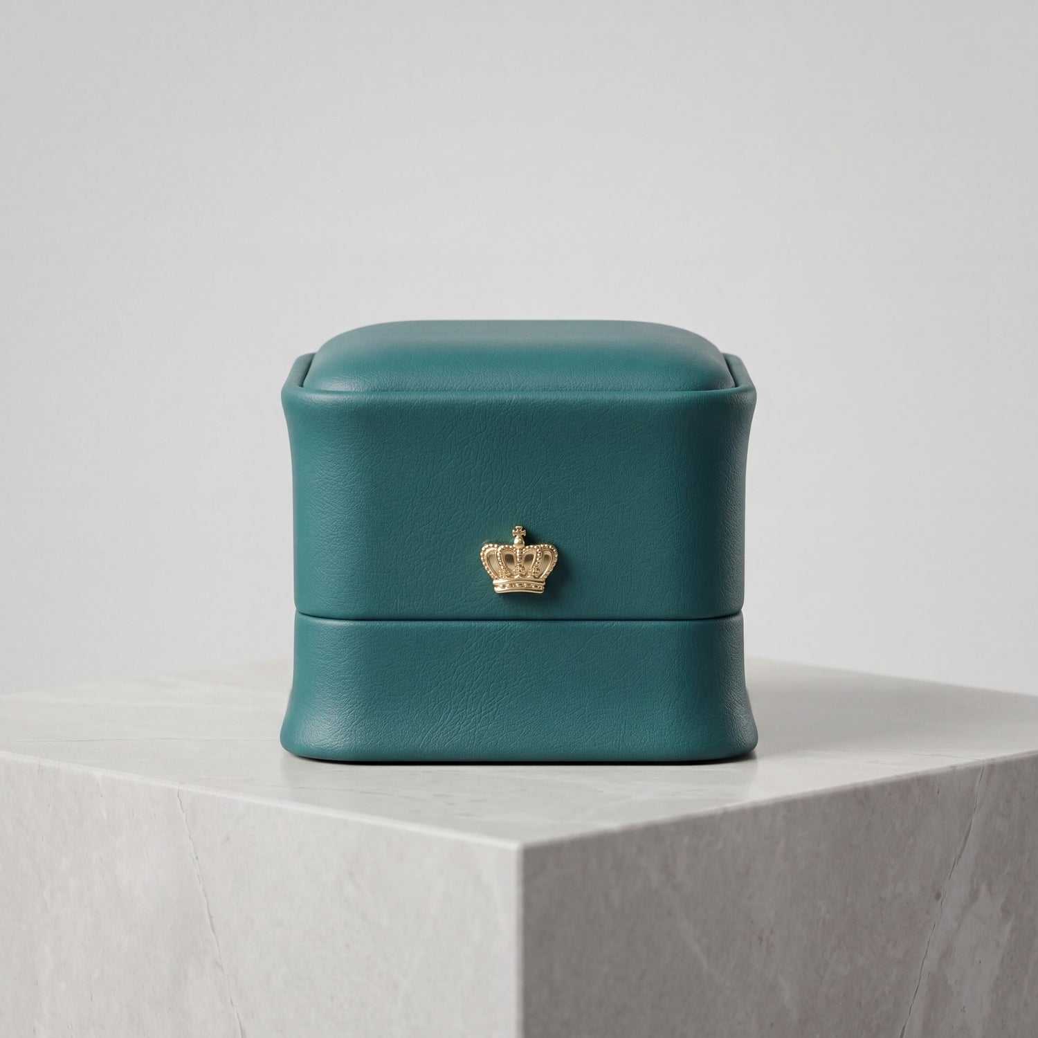 Emerald Green leather ring box closed front view on marble · Ormelya