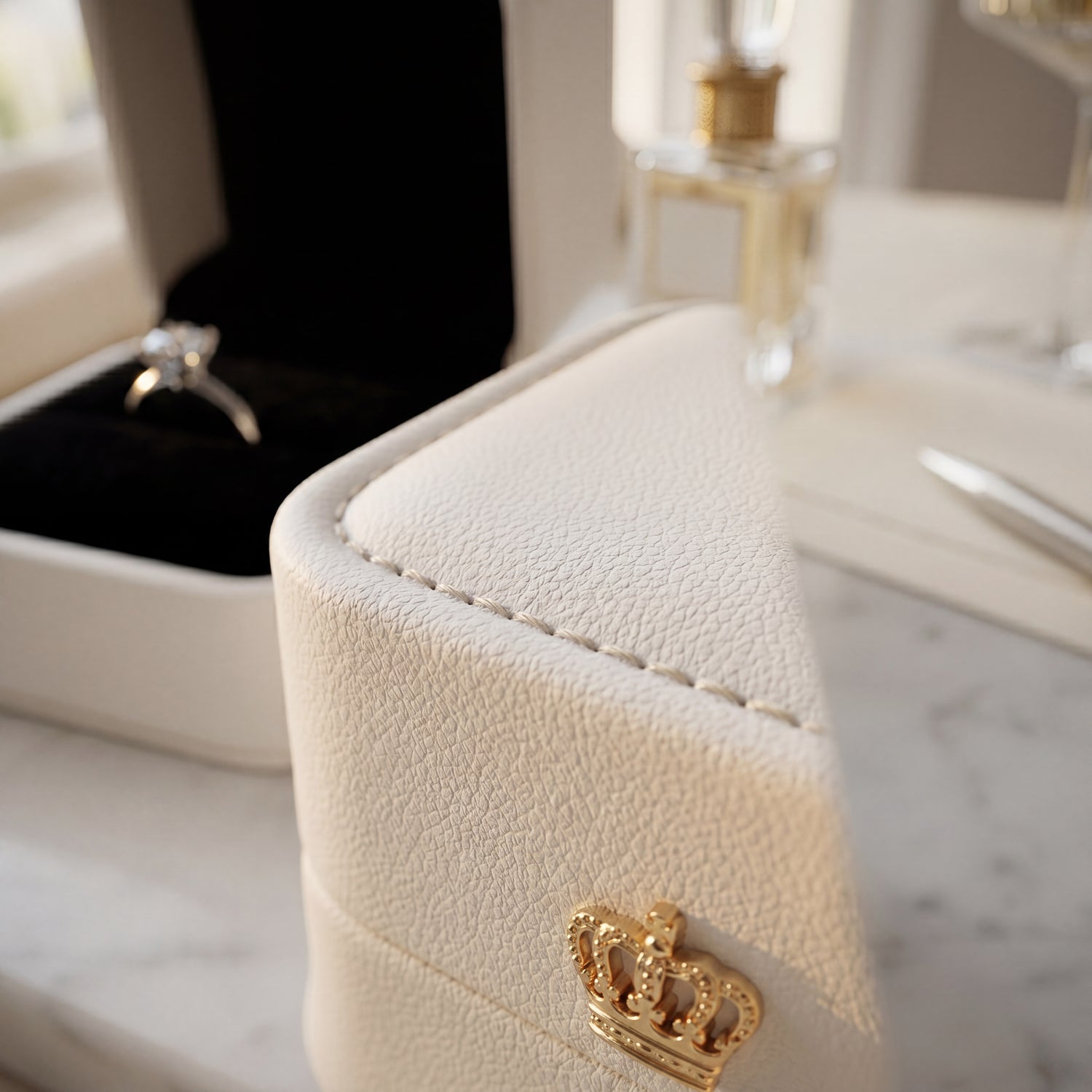 Pearl White ring box open with diamond ring leather texture close-up · Ormelya