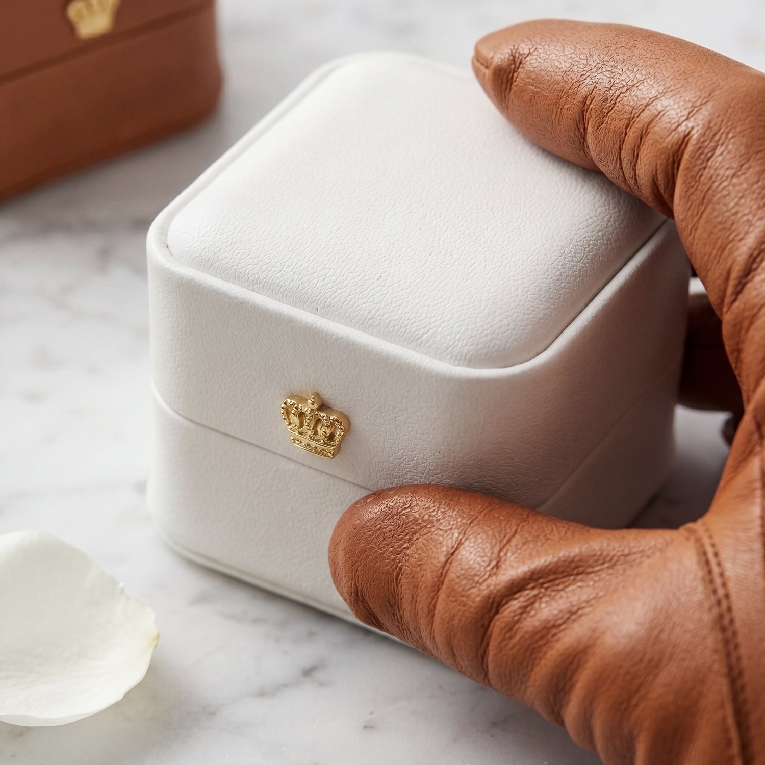 Pearl White ring box held in leather gloves lifestyle · Ormelya